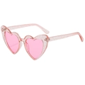Close-up of pink translucent heart-shaped sunglasses with glitter and UV400 lenses - Glitter