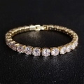 Detailed close-up of gold plated tennis bracelet with round cubic zirconia in claw setting - 5mm Yellow Gold 17cm