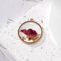 Detailed macro view of a round resin pendant with a red dried rose and gold foil flakes - Gold Foil One Rose