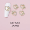 Detailed view of 11x10mm bow nail charm with hollow heart and rhinestone accents - Gold Hollow Heart Bowknot Style (A082)