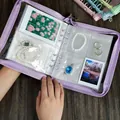 Portable purple jewelry organizer book with PVC pockets for rings and earrings - Purple (With 50x3-inch + 10x5-inch Bags)
