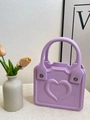 Mini purple heart-embossed EVA handbag with silver rivets and top handle design - Purple