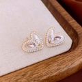 Detailed macro view of heart-shaped tulip stud earrings with pearls and pink crystals - 17# Silver Earring Post-White (Heart Tulip Pearl)