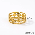 Macro shot of gold hollow ring with beaded details and adjustable open band design - Gold Twisted Rhombus Hollow