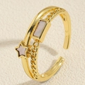 Detail of gold double-layer open ring featuring star and rectangle shell inlays - Star Shell Ring / Gold