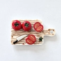 3D miniature ceramic fridge magnet featuring a cutting board with realistic tomatoes - Tomato Cutting Board