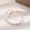 Detail of sweet girl love bracelet with white freshwater pearls and golden heart pendant - White Oval Artificial Pearl Rose Gold Style / Rose Gold (X642)