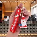Christmas Santa PVC keychain with blue gift box and red hand strap, size 5.9x3.7cm - Santa Claus-6