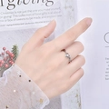 Elegant heart shaped silver ring with round zircon gemstone on model finger - Heart Hollow Round Diamond / J154 (White Gold)
