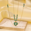 Close-up of double-layer gold chain necklace with blue beads and green enamel heart pendant - [tsh1119] Heart Golden Balls Lvzhu Necklace Gold