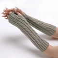 Close-up of grey cable-knit fingerless gloves with thumb hole for winter warmth - Yellow Grey