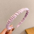 Close-up of lavender pleated satin headband showing rich fabric texture and silk sheen - Light Purple