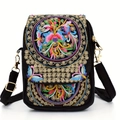 Ethnic embroidery mini crossbody bag in black canvas featuring vibrant floral and bird patterns - Money Flower