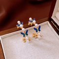 Close-up of C-shaped gold earrings with blue enamel butterflies and white pearls - 14# Gold Enamel Butterfly Pearl Style (14#)