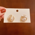 Elegant gold spiral shell stud earrings with white enamel and a central pearl - White Geometric Pearl