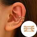 Three-layer golden ear cuff with sparkling white zircons worn on earlobe model - KC Gold - Triple Layer Diamond Style (H-158)