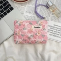 Detailed close-up of a floral bear quilted pouch with a purple handle on a vintage background - Flower Yellow Rabbit
