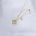 Macro shot of gold S925 silver hollow heart necklace with sparkling zircon crystals - 925 Silver / Gold
