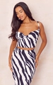 Close-up of black and white zebra print pleated fabric on two-piece strap top and skirt - Black White Zebra Print