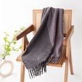 Plaid scarf in dark grey and dark purple knit with tassels draped on a wooden chair - Purple