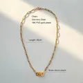 Close-up of 18K PVD gold plated stainless steel chain with a zircon oval pendant - Paperclip Chain Circle Charm Necklace
