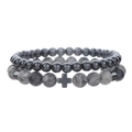 Detail of 4mm and 6mm hematite beaded bracelets featuring a black cross and lava tiger eye stones - 6mm Hematite + 8mm Map Stone