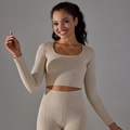 Close-up of seamless breathable knit texture on high-elasticity yoga sportswear - Beige