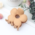 Beige floral matte hair claw clip for women styled with aesthetic candles on white background - Matte Khaki