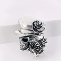 Close-up of gothic punk skull with top hat and roses in vintage silver finish - Rose Skull Punk Style