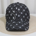 Detail view of black denim baseball cap featuring vintage distressed holes and silver sequins - Style 24-Black Distressed Silver Sequins