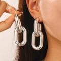 Detail of chunky silver punk hoop earrings showing geometric link design on model - Silver Double Ring Stud Earrings (DZ-876)