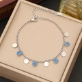 Macro shot of stainless steel chain with blue evil eye beads and round charms on a box - Silver Disc (4#)