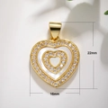 Detail shot of heart-shaped shell pendant with 22mm by 16mm dimensions and gold plating - Shell Heart