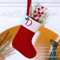Red knit Christmas stocking with white cuff and red embroidered letter D ornament - Letter D / Red