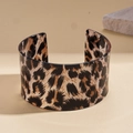Detailed close-up of acrylic wide open cuff bangle with classic leopard print pattern - Coffee Leopard