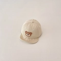 Detail of beige baby baseball cap featuring cute brown bear embroidery on soft cotton fabric - Khaki
