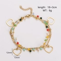 Double-layered gold bracelet with colorful beads and hollow heart charms measuring 12x13mm - Hollow Heart