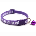Detail of purple nylon pet collar with white paw prints, buckle, and purple bell - JY Paw Print / Purple