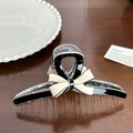 Elegant black and beige acetate hair claw clip with a 3D bow design on wood surface - Black Base Ribbon Large-13cm