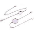 Macro detail of silver stainless steel bracelet tray with star charm and lobster clasp - Style 2