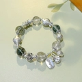 Ethnic beaded bracelet with green crystal stones and silver-toned prosperity charms - 12mm Green Ghost: Abundant Wealth Double Fish Bracelet