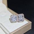 Square halo silver stud earrings with clear sparkling stones in a gold jewelry box - Rectangular White Diamond Stud Earrings Tz-34