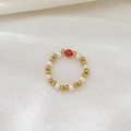 Elastic beaded ring featuring 18K gold beads, white freshwater pearls and red accent bead - Red