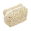 Floral makeup bag in beige with yellow flower patterns and white zipper closure - Orange Floral