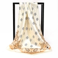 Detail of satin square scarf featuring brown paisley patterns on a beige silk texture - Beige Paisley Style (010)