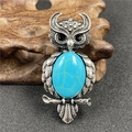 Retro silver owl brooch with large oval turquoise stone inlay and intricate feather texture - Synthetic Blue Turquoise