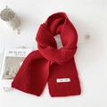 Thick red knitted winter scarf for women in a soft warm fabric shown on white background - Red