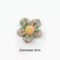 Detail of 4cm plaid fabric five-petal flower accessory with a yellow corduroy center - Green Pink Plaid Flower