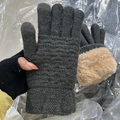 Detail of warm dark grey knitted gloves with wavy pattern and plush fleece lining - Dark Gray