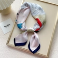 Silk neck scarf with colorful geometric patterns in a stylish gift tray display - Pink Wave Belt